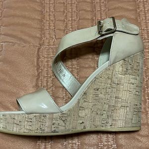 Stuart Weitzman wedge sandals in tan patent